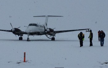 The King Air prepares for flight during a snowstorm in Boise.